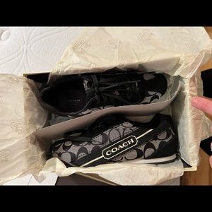 Women’s black coach sneaker.